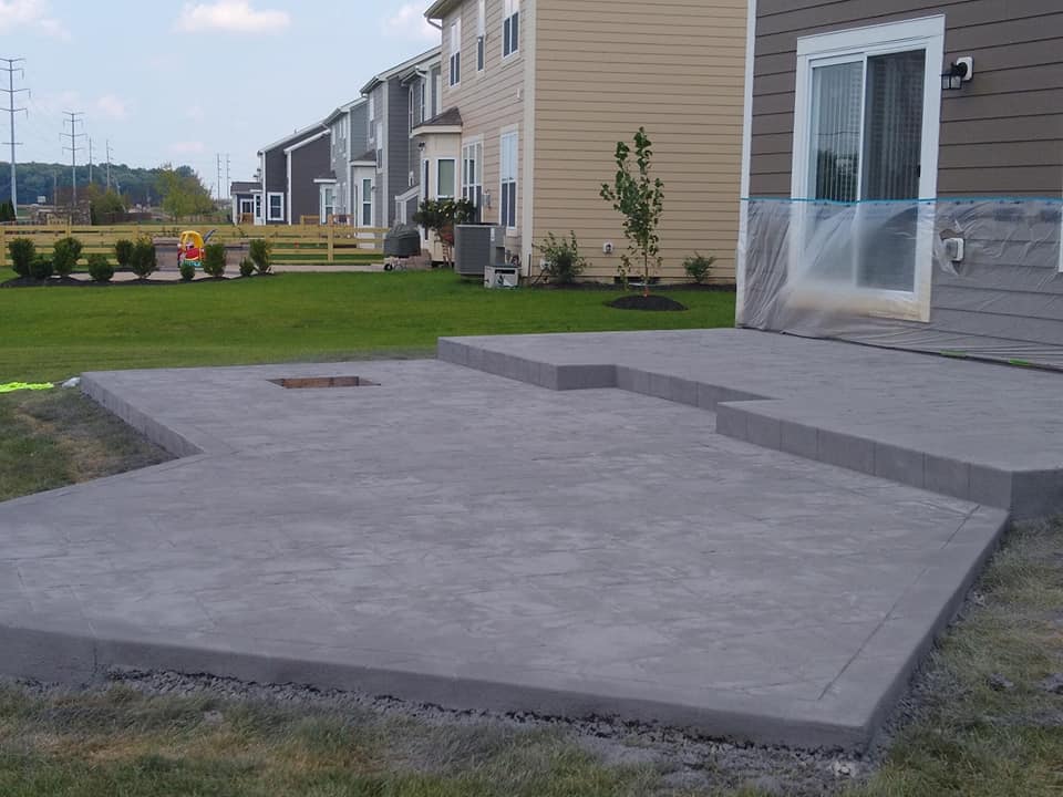 Unique shaped concrete patio poured by concrete contractor