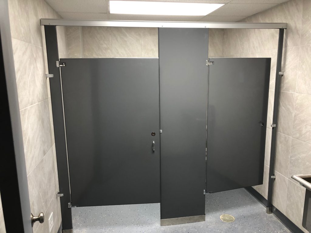 Professional remodeling contractors finished industrial bathroom with tiled walls