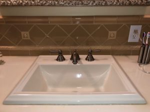 Bathroom remodel with back-splash tile installation